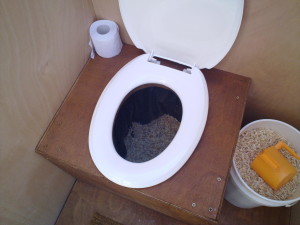 Sawdust composting toilet waste